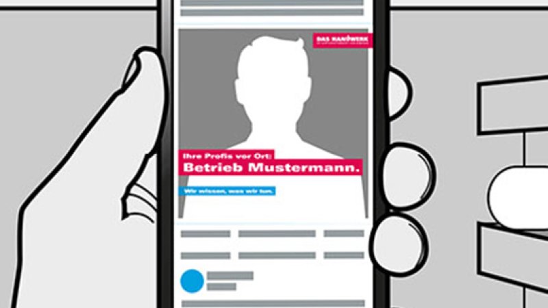 Hand mit Handy vor Grafik